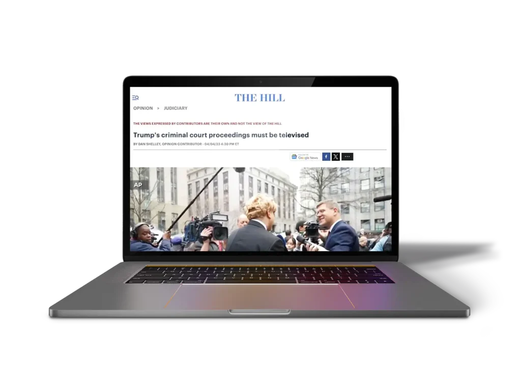 Laptop with an article pulled up reading "Trump's criminal court proceedings must be televised"