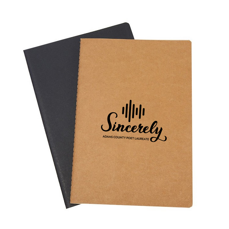 Kraft notebooks on top of one another, with the top one displaying the Anythink Sincerely logo in black.