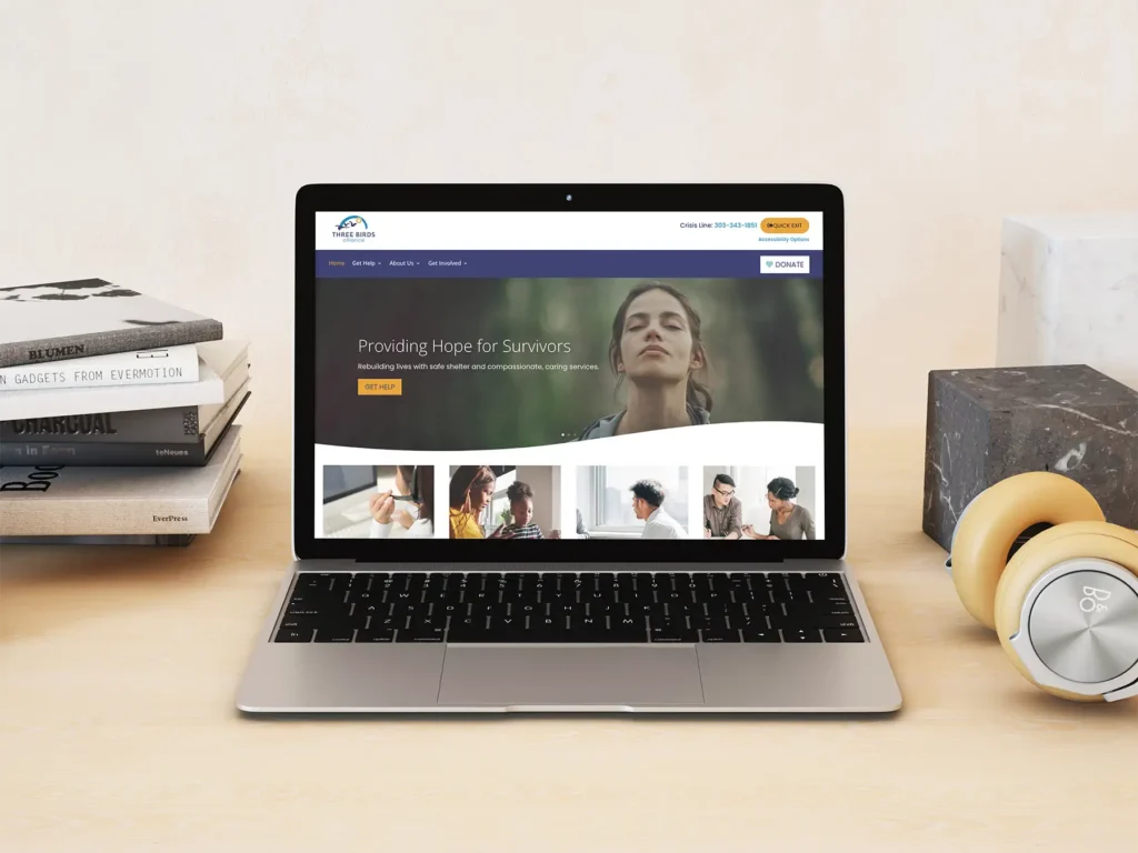 A laptop with the new Three Birds website pulled up on it.