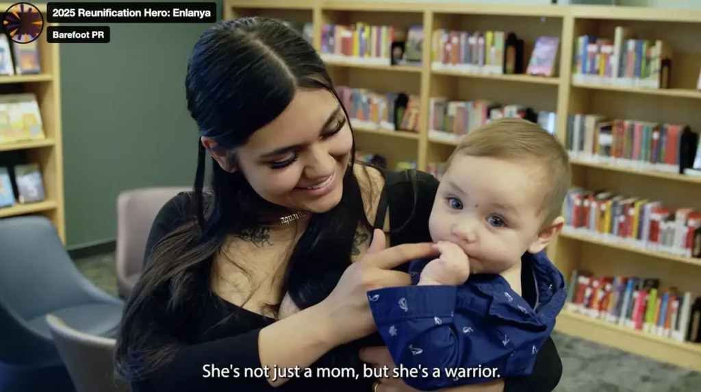 A mother holding her baby in a library