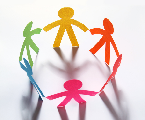 People cut out of colorful pieces of paper placed in a circle