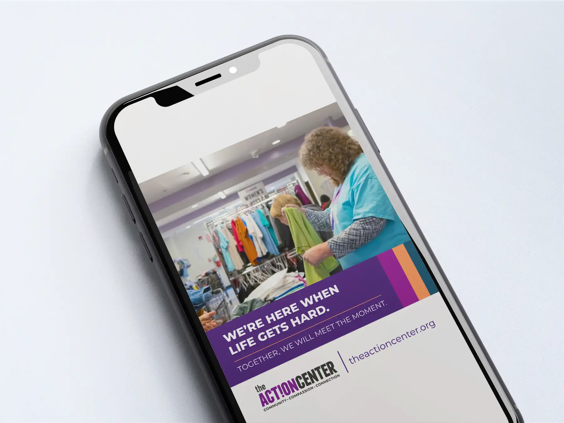 Social Graphic of a woman looking through a pile of clothes with text that reads "We're here when life gets hard"