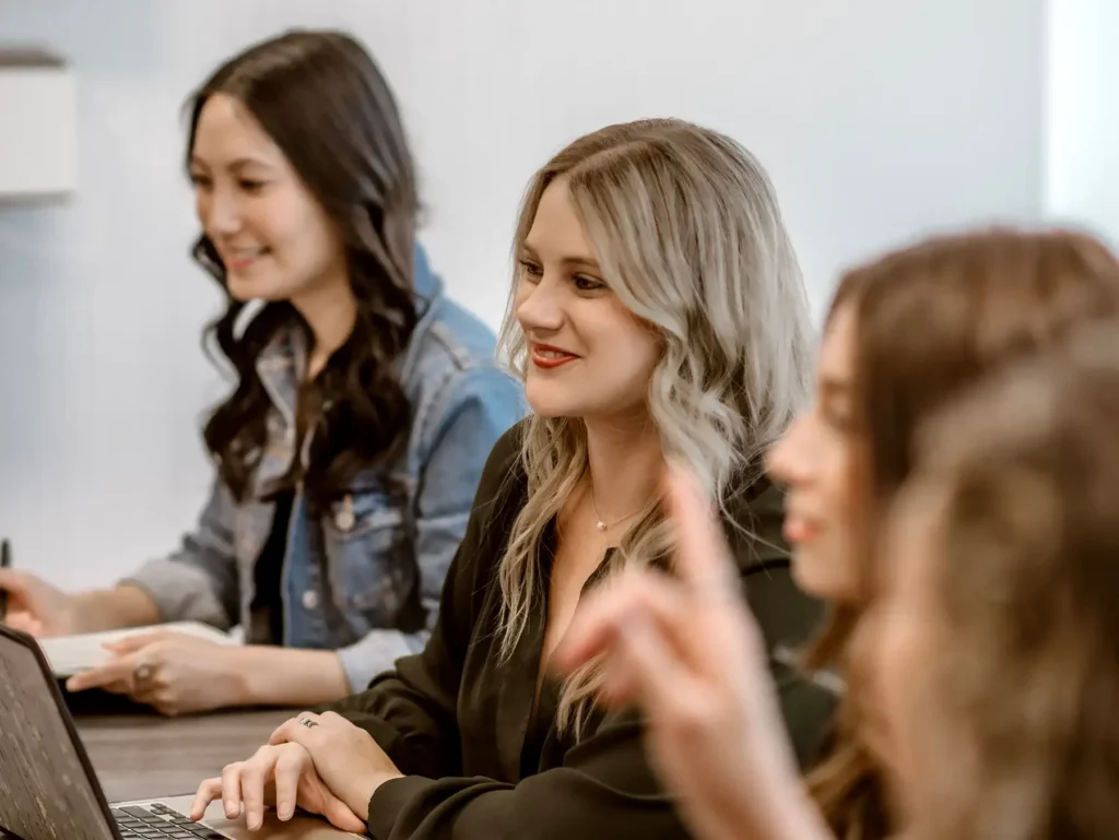 A group of Barefoot team members meet in a conference room