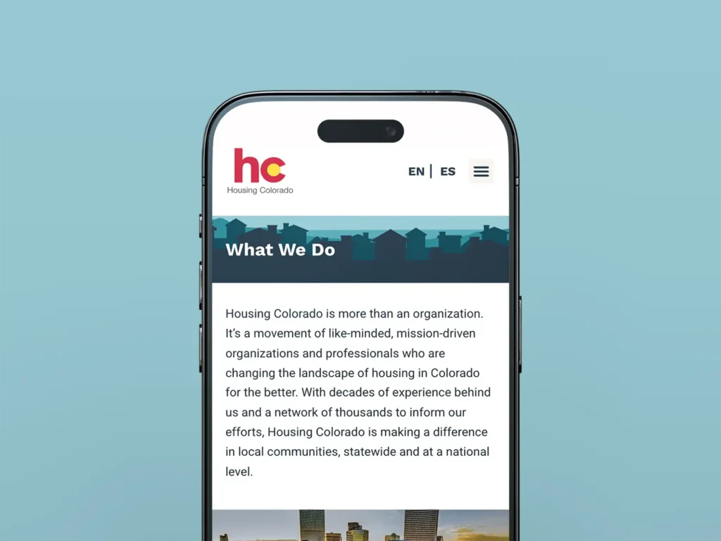 An iPhone on the Housing Colorado "What We Do" page